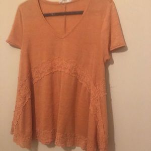 Orange v neck shirt with lace details
